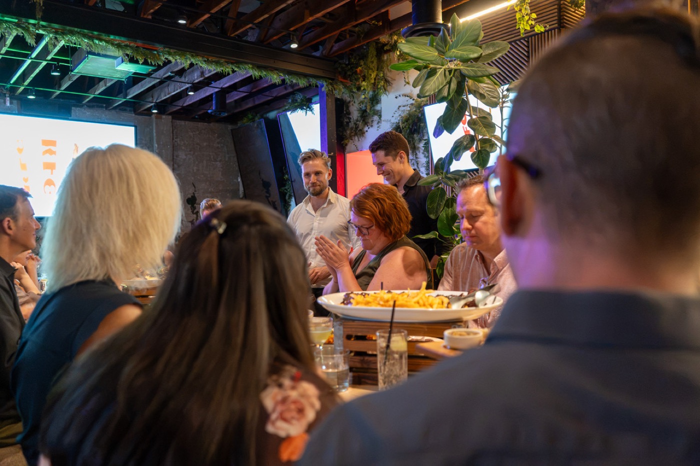 Guests in conversation over dinner